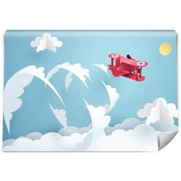 Fototapeta samoprzylepna Czerwony samolot wykonujący akrobacje na niebie