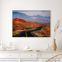 Obraz na płótnie Otwarta droga w czerwonym skalistym pustynnym terenie 