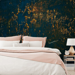 Fototapeta samoprzylepna Granatowa ściana z ozdobnymi złotymi plamami