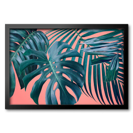 Obraz w ramie Duże tropikalne liście nakładające się na siebie na różowym tle