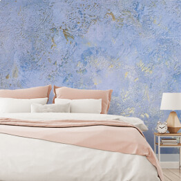 Fototapeta Niebieska ściana ze złotymi połyskującymi dekoracjami