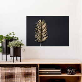 Plakat samoprzylepny Liść palmy w złotym kolorze na ciemnym tle