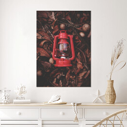 Plakat Czerwona latarenka na jesiennych liściach