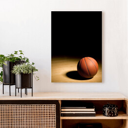 Obraz na płótnie Piłka do koszykówki na drewnianym parkiecie