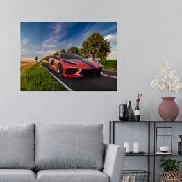 Plakat samoprzylepny Nowoczesny czerwony Chevrolet oświetlony wschodzącym słońcem