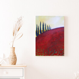 Obraz na płótnie Drzewa na wzgórzu pokrytym czerwoną trawą