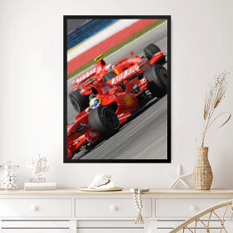 Obraz w ramie Czerwone sportowe auto Ferrari oświetlone promieniami słońca