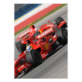 Plakat Czerwone sportowe auto Ferrari oświetlone promieniami słońca