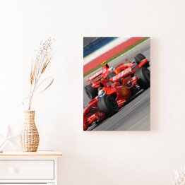 Obraz na płótnie Czerwone sportowe auto Ferrari oświetlone promieniami słońca
