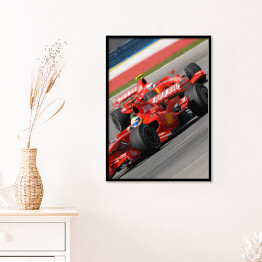 Plakat w ramie Czerwone sportowe auto Ferrari oświetlone promieniami słońca