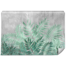 Fototapeta samoprzylepna Tropikalne liście palmowe w turkusowych barwach na tle imitującym beton