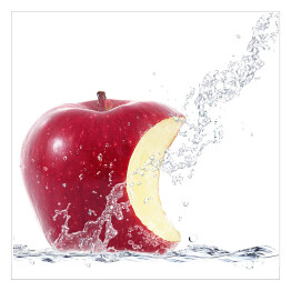 Plakat samoprzylepny Strumień wody uderzający w nadgryzione jabłko