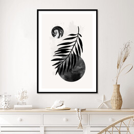 Liść palmy na tle kompozycji geometrycznej abstrakcji w odcieniach szarości i czerni