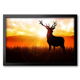 Obraz w ramie Postać jelenia na tle zachodzącego słońca