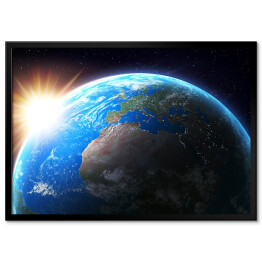 Plakat w ramie Słońce zachodzące nad Ziemią