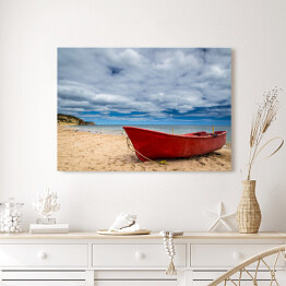 Obraz na płótnie Czerwona łódź na plaży