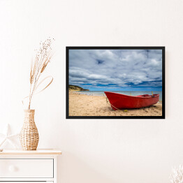 Obraz w ramie Czerwona łódź na plaży
