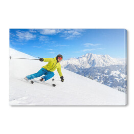 Obraz na płótnie Narciarz zjeżdżający slalomem z gór