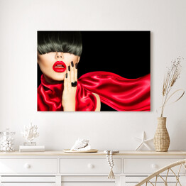 Obraz na płótnie Kobieta z modną fryzurą, makijażem i manicure w czerwonym ubraniu