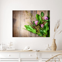 Plakat samoprzylepny Wiosenne zioła rozłożone na drewnianym stole