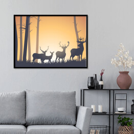 Plakat w ramie Dzikie zwierzęta w lesie na tle zachodzącego słońca