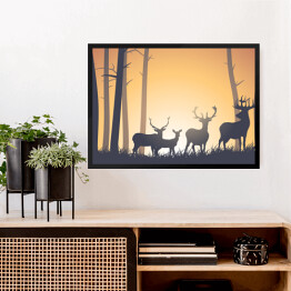 Obraz w ramie Dzikie zwierzęta w lesie na tle zachodzącego słońca