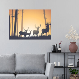 Plakat samoprzylepny Dzikie zwierzęta w lesie na tle zachodzącego słońca