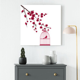 Obraz na płótnie Czerwony ptak w klatce na gałęzi z kwiatami