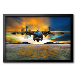 Obraz w ramie Lądowanie samolotu wojskowego na tle płomiennego nieba