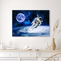 Obraz na płótnie Astronauta na tle przestrzeni kosmicznej