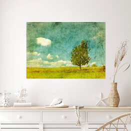 Plakat samoprzylepny Obraz drzewa na łące w pochmurny dzień