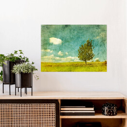 Plakat samoprzylepny Obraz drzewa na łące w pochmurny dzień