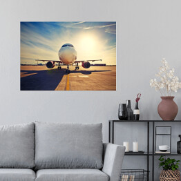 Plakat samoprzylepny Duży samolot na tle wschodu słońca