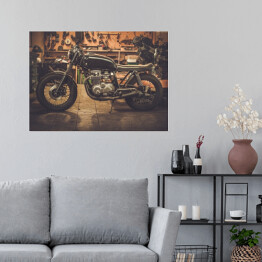 Plakat samoprzylepny Vintage motocykl na drewnianym podeście w garażu