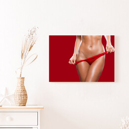 Obraz na płótnie Kobieta zdejmująca czerwoną bieliznę