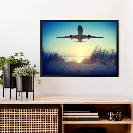Obraz w ramie Samolot lecący nad plażą