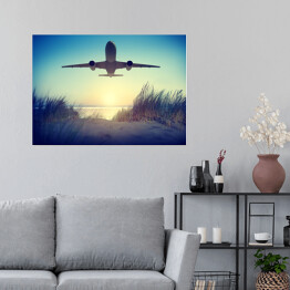 Plakat Samolot lecący nad plażą