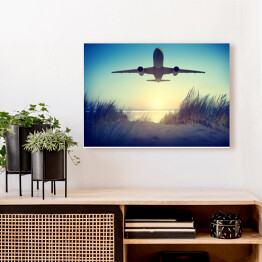 Obraz na płótnie Samolot lecący nad plażą