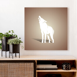 Obraz na płótnie Biała sylwetka wilka na beżowym tle