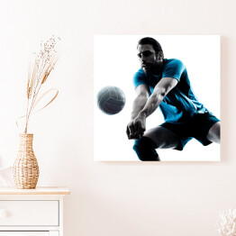 Obraz na płótnie Sylwetka człowieka podczas gry w piłkę siatkową