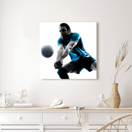 Obraz na płótnie Sylwetka człowieka podczas gry w piłkę siatkową