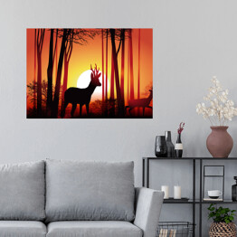 Plakat Jeleń w lesie na tle złocistego zachodu słońca