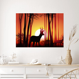 Plakat Jeleń w lesie na tle złocistego zachodu słońca