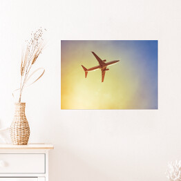 Plakat samoprzylepny Samolot przecinający promienie słońca