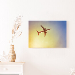 Obraz na płótnie Samolot przecinający promienie słońca