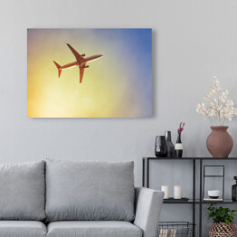 Obraz na płótnie Samolot przecinający promienie słońca