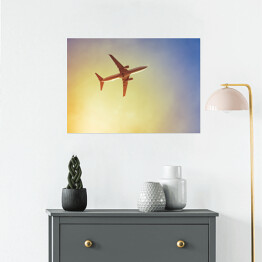 Plakat Samolot przecinający promienie słońca