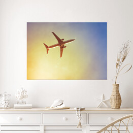 Plakat samoprzylepny Samolot przecinający promienie słońca