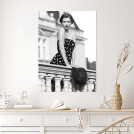 Plakat Młoda kobieta na balkonie. Czarno biała fotografia