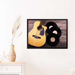 Obraz w ramie Gitara i winylowe płyty na drewnianym stole
